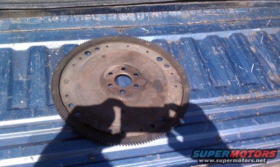 Flywheel sitting in the bed of a pickup truck