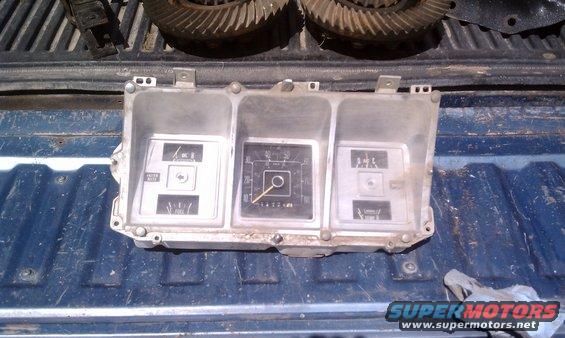 Dashboard instrument cluster with gauges and odometer