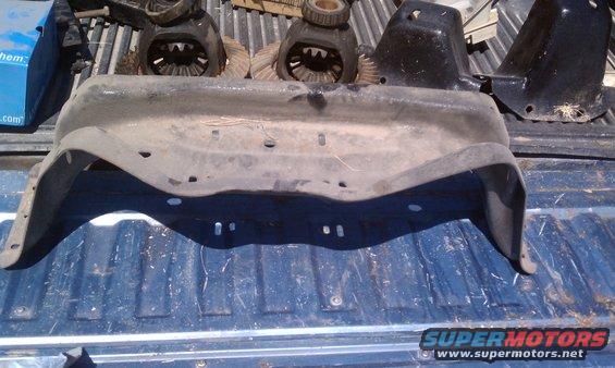 Differential gears and a dirty fender liner on a truck bed