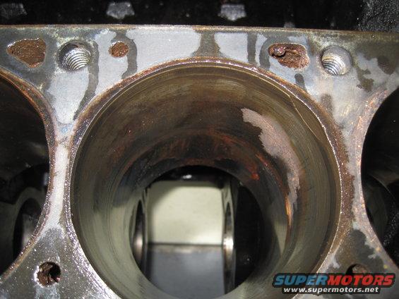 Engine block cylinders with rust and water damage