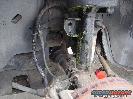 Front suspension and brake components with SuperMotors.net logo