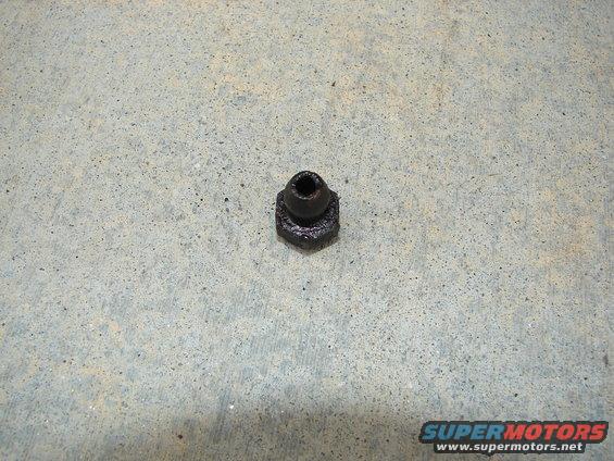 Black brake line fitting on concrete