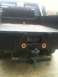1997 Ford F-350 - Rear view of a black flatbed truck with a gooseneck hitch and diamond plate accents.