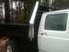 1997 Ford F-350 - Side view of a 1997 Ford F-350 pickup truck with a flatbed and diamond plate tool box.