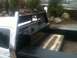 1997 Ford F-350 - Rear view of a 1997 Ford F-350 truck bed, showing custom modifications and diamond plate accents.