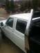 1997 Ford F-350 - This white 1997 Ford F-350 crew cab pickup truck features a diamond plate tool box mounted in the bed.