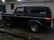 1978 Ford Bronco - This black 1978 Ford Bronco is seen from the side, chrome accents and aftermarket wheels.