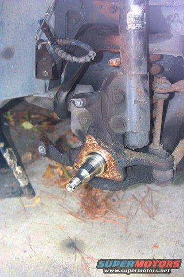 Front suspension spindle and brake assembly