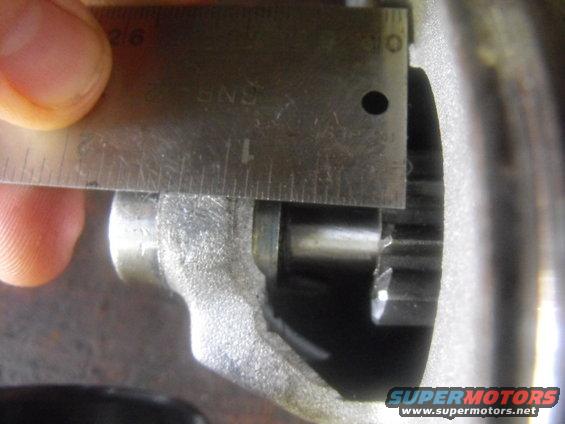 The starter wasn't engaging the ring gear teeth. You can see the distance from the housing to the end of the shaft is just .6375 inches or barely eleven sixteenths of an inch 11/16