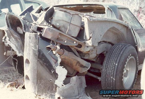 1976 Chevrolet Corvette rear quarter panel damaged, showing exhaust pipe and tire