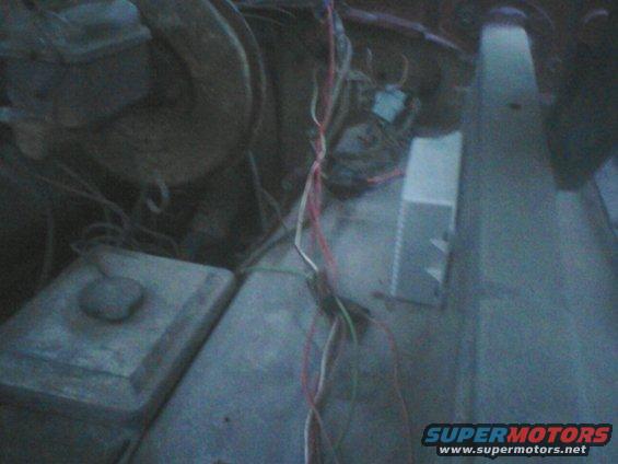 Engine bay with exposed wiring and components