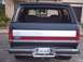 1990 Ford Bronco - The rear of a Ford Bronco shows its distinctive stripe and license plate.