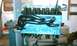 1994 Ford F-250 - Engine block and exhaust manifold assembly on a stand.