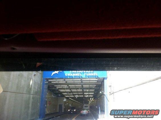 Chesapeake Channel Tunnel entrance with two cars driving in