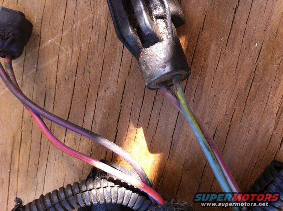 close-up of a wiring harness connector with multiple colored wires