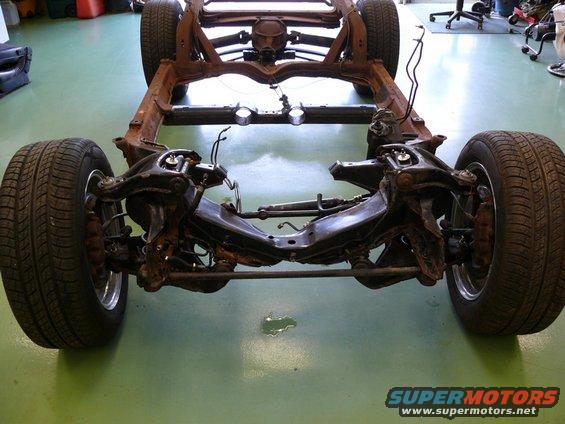 Car frame and suspension with wheels attached