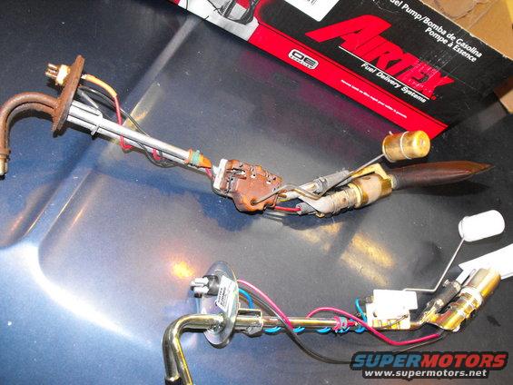 dscf1862.jpg Here's old (not working) and new side by side. My in-tank pump is at least 14 years old now, so it's a freebie along with a new fuel strainer for the same price as a sending unit. I remember the previous owner whining about a $500.00 repair bill for the in-tank pump. Guess two hours on my back was worth it.