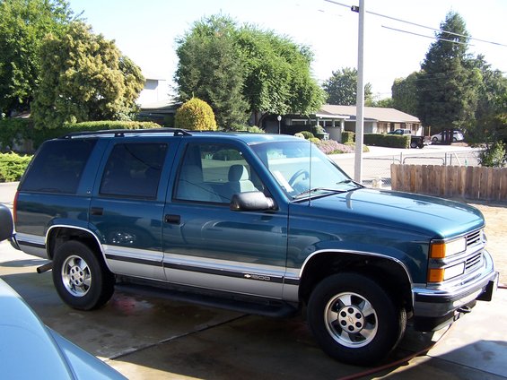 Teal 1995 Chevrolet Tahoe parked on driveway, 3q-front view