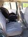 1995 Chevrolet Tahoe - The interior of a 1995 Chevrolet Tahoe shows the back seat with a car seat installed.