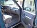 1995 Chevrolet Tahoe - View from the passenger side into the driver's side of a teal SUV, focusing on the interior details.
