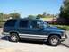 1995 Chevrolet Tahoe - This 1995 Chevrolet Tahoe is seen from the side under a clear blue sky.