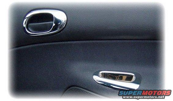 Interior car door panel with two chrome door handles and textured black trim