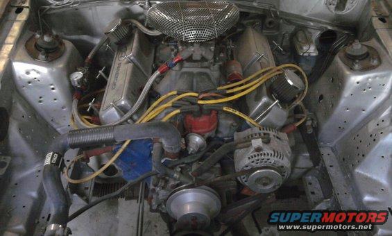 Engine bay with V8 engine, chrome valve covers, and air filter