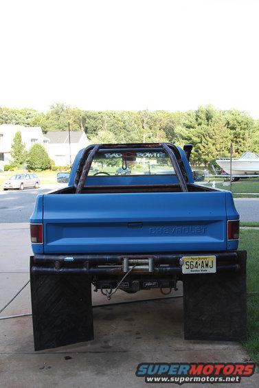 1978 Chevrolet C/K Pickup rear with large mud flaps and roll bar