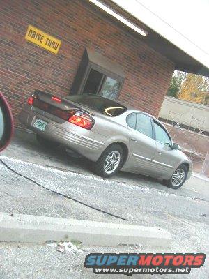 Silver Pontiac Grand Prix at a drive-thru