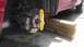 2007 Dodge Caliber - A yellow bubble level is attached to the brake rotor of a car that is supported by wooden blocks.