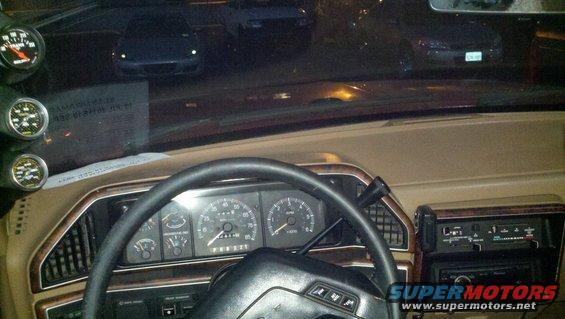 1989 Ford Bronco interior with dashboard gauges and aftermarket gauges
