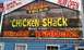 1994 Ford F-250 - A sign for Chicken Shack restaurant is visible, advertising wings and dinners.