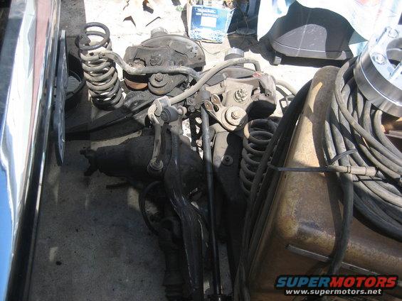 Front suspension components and differential assembly with coiled springs