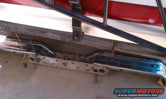 Rear bumper and taillight assembly with exposed wiring