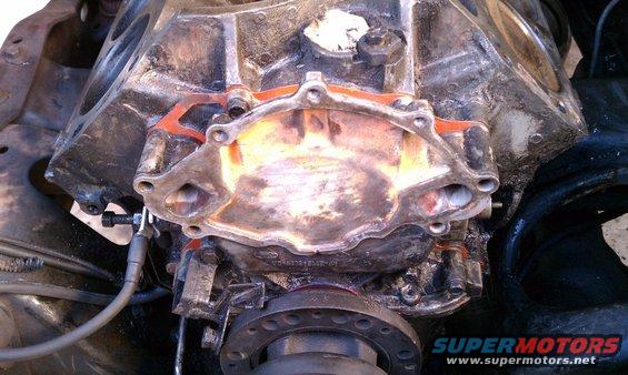 Engine block with water pump gasket removed, showing internal passages