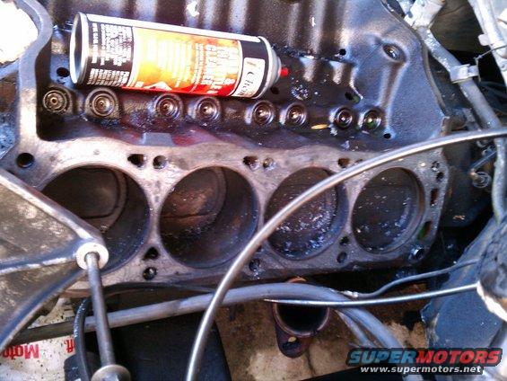 Engine block with spray can on top