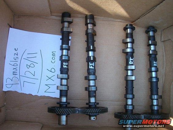 Four camshafts with gears, one with a note reading '93 mx6/size 7/28/11 MX6.com'