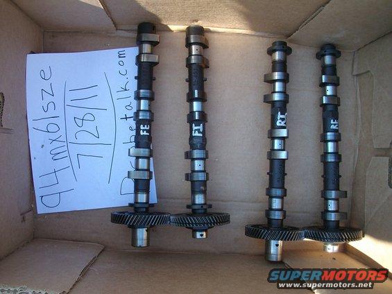 Four camshafts in a box with a note that says '94 mx6/lsze 7/28/11'