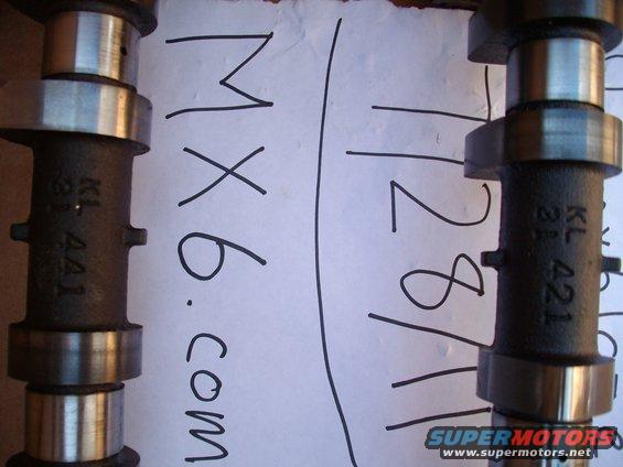 Two camshafts with markings KL 421 and MX6.com