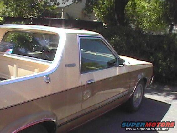 Side view of a tan and brown Ford Ranchero pickup truck