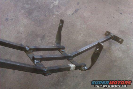 Welded metal frame structure with several mounting brackets attached