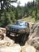 1995 Ford Bronco - This 1995 Ford Bronco is shown tackling a challenging off-road course.