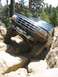 1995 Ford Bronco - A 1995 Ford Bronco tackles a challenging rocky off-road course.