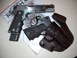 1986 Ford Bronco II - Springfield Armory 1911 pistol and holster are laid out on a magazine.