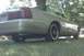2000 Mercury Grand Marquis - Rear quarter view of a tan 2000 Mercury Grand Marquis, aftermarket black wheels and a chrome exhaust tip.