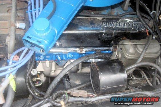Engine bay with blue intake and "POWER BY FORD" valve cover