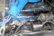 1976 Ford Ranchero - Close-up of an engine bay, showing a blue intake manifold and a valve cover with "POWER BY FORD" lettering.