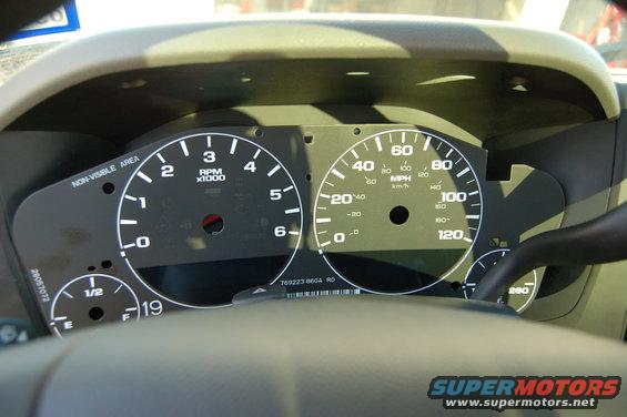 Dashboard gauges with tachometer and speedometer, part number 769223-860A RO visible