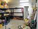 1993 Ford F-250 - A cluttered garage scene with storage shelves, boxes, and various equipment.
