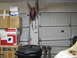 1993 Ford F-250 - Interior view of a garage with stacked boxes, a hose reel, and multiple garage doors visible.